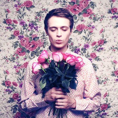 Young beautiful man with flowers clipart