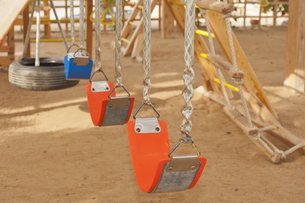 Swings in a childrens play area — Stock Photo, Image