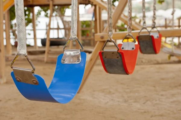 Swings in a childrens play area — Stock Photo, Image