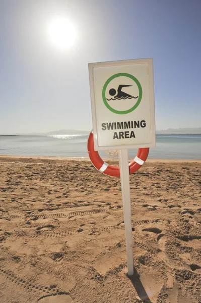 Swimming sign on a tropical beach — Stock Photo, Image