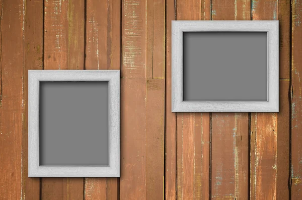 Wit hout afbeeldingsframe op bruin muur — Stockfoto