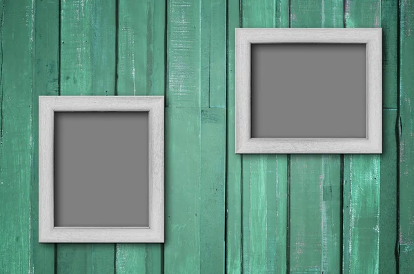 White wood picture frame on Green wall — Stock Photo, Image