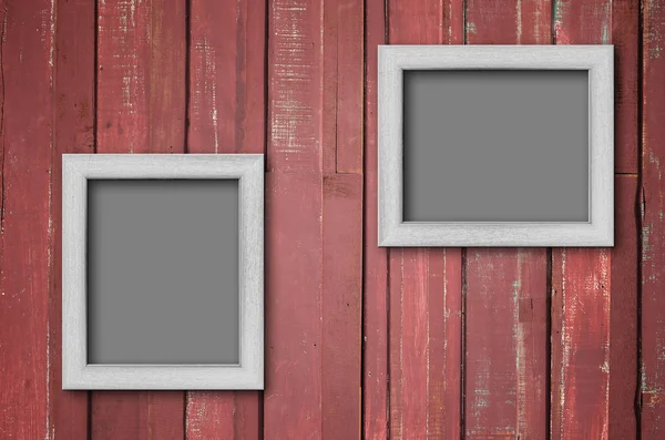 Cadre photo en bois blanc sur mur rouge — Photo