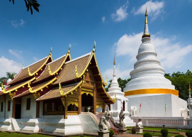 Cathedral and pagoda at Phra Singh Temple clipart