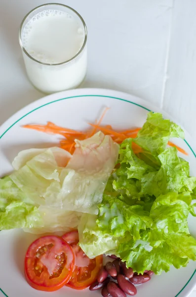 stock image Vegetable Salad in White plate with Milk