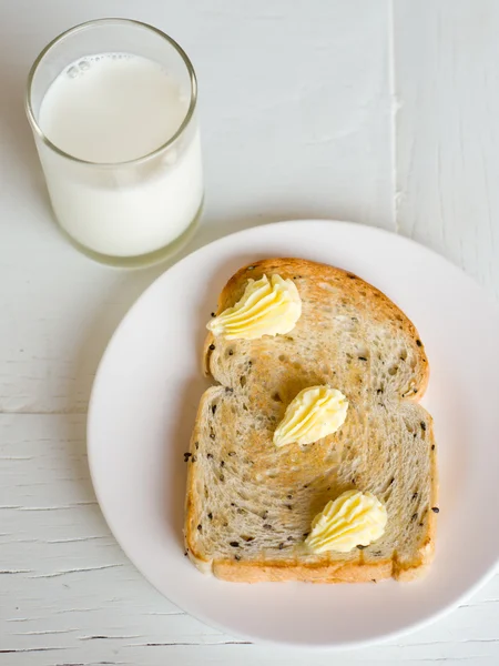 stock image Bread butter on white plate