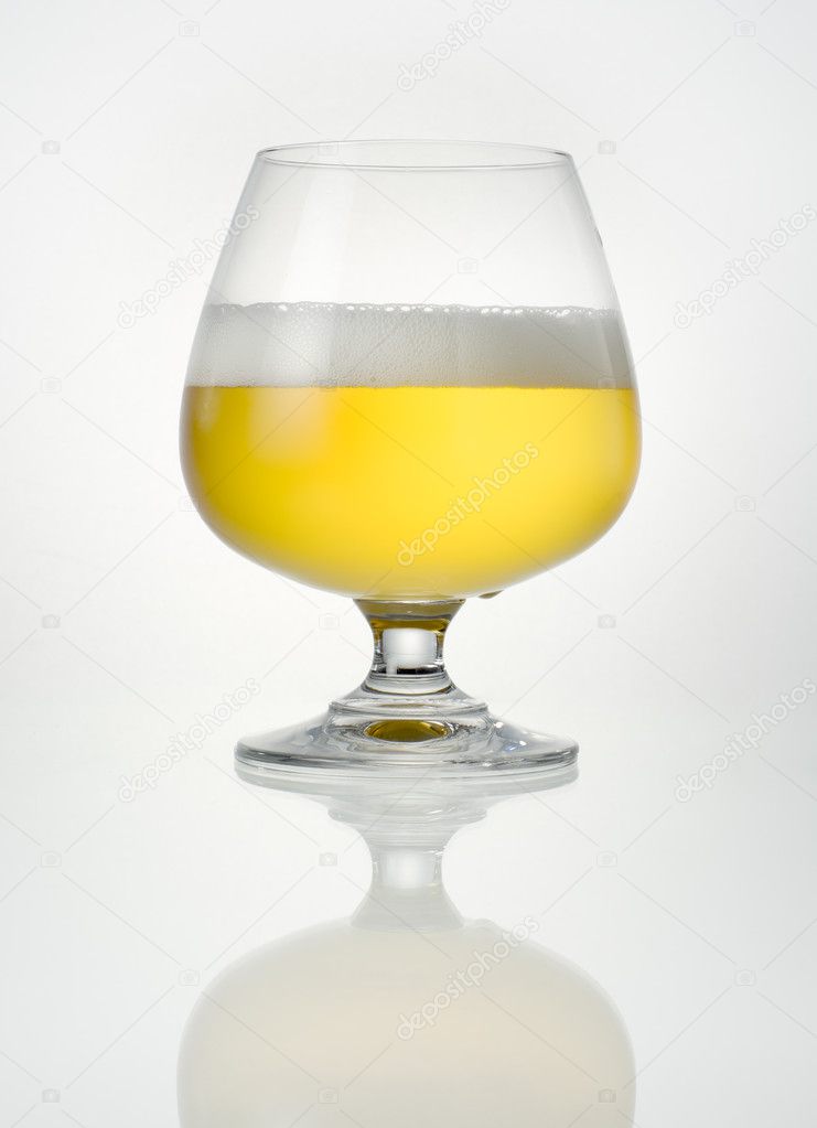 Beer in glass with reflection