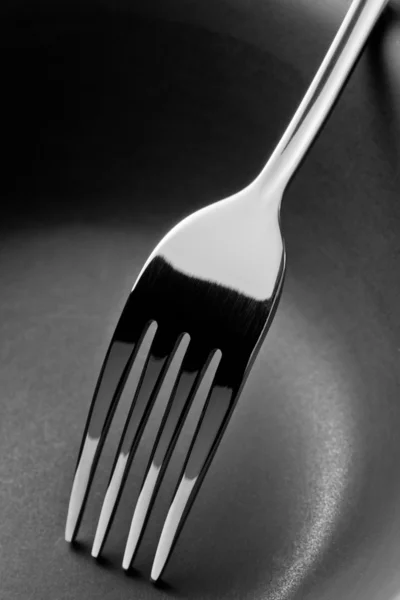 Fekete-fehér rozsdamentes acél villával — Stock Fotó