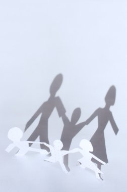 Paper chain: man, woman and baby and shadows from them. F clipart