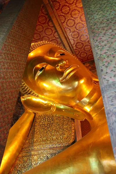 The reclining Buddha at Wat Pho in Bangkok, Thailand.