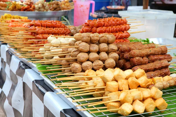 Meatballs on sticks at a market — Stock Photo, Image
