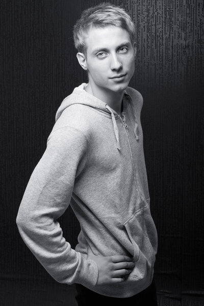 Handsome young man on black