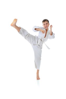 Young boy training karate. clipart