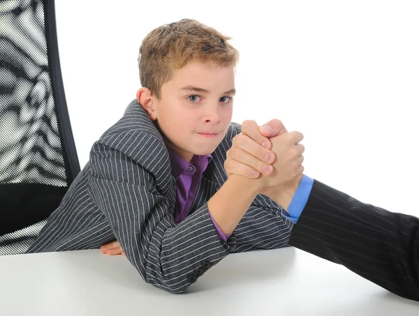 Boy and a man arm wrestling — Stock Photo, Image