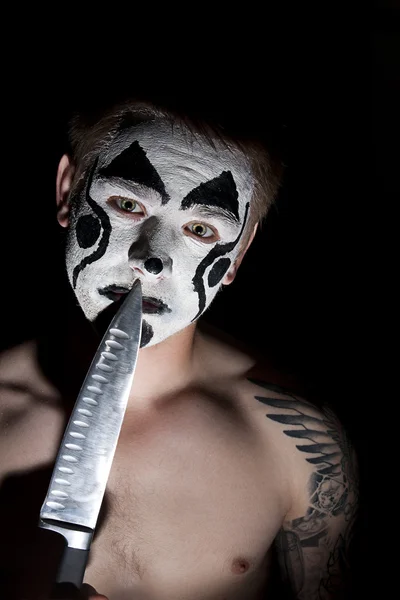 Evil clown with a knife — Stock Photo, Image