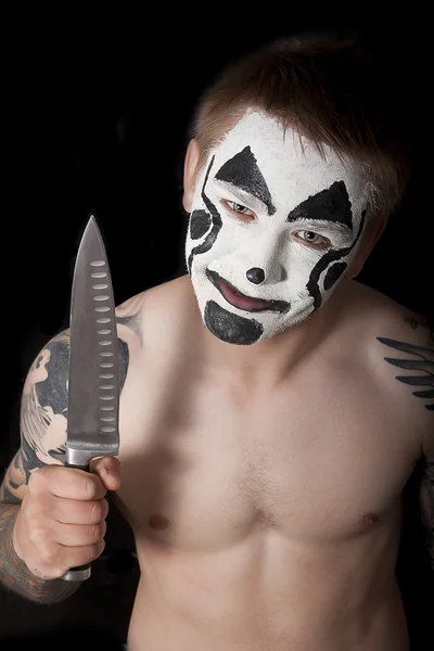 Evil clown with a knife — Stock Photo, Image