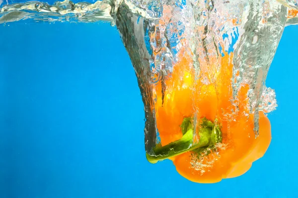 Stock image YELLOW PEPPER SPLASHING IN WATER