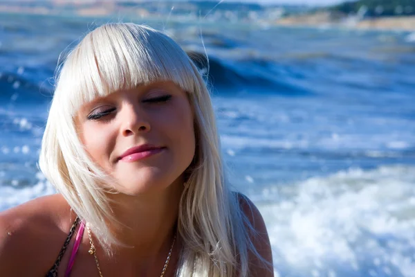 stock image The beautiful blonde the girl against the sea