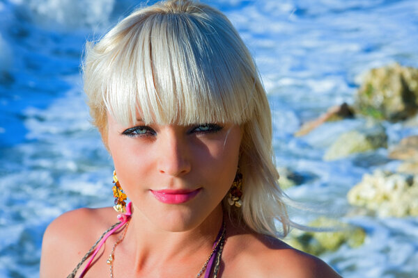 The beautiful girl against the sea