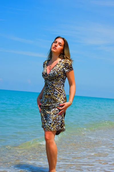 Stock image Beautiful woman on stone beach