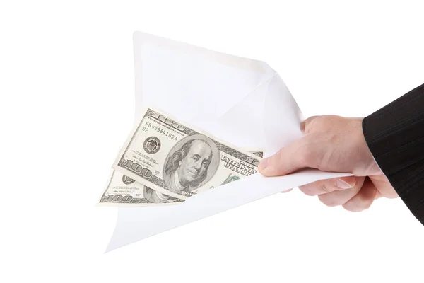 Hand en geld in de envelop geïsoleerd op witte achtergrond — Stockfoto
