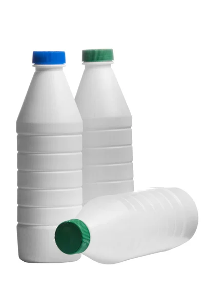 Fles van melk met een caps gekleurde geïsoleerd op witte achtergrond — Stockfoto
