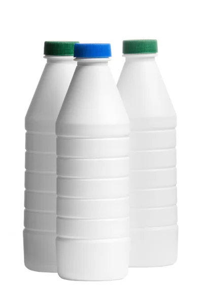 Μπουκάλι γάλα με καλύμματα ένα έγχρωμο απομονωθεί σε λευκό φόντο — Φωτογραφία Αρχείου