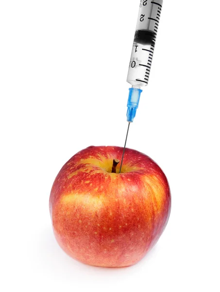 แอปเปิ้ลสีแดงและหลอดฉีดยาแยกจากสีขาว — ภาพถ่ายสต็อก