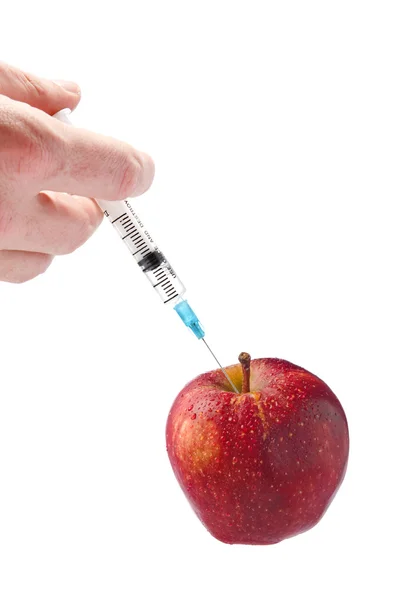 Red apple with a syringe on a white background — Stock Photo, Image
