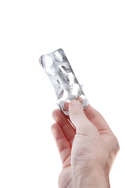 Mãos com pílulas isoladas no fundo branco — Fotografia de Stock