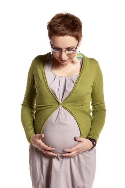 Femme enceinte regardant son ventre — Photo