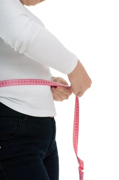 La mujer mide los volúmenes corporales —  Fotos de Stock