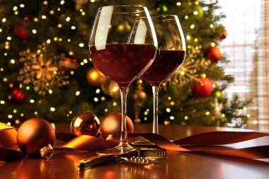 Red wine on table Christmas tree clipart