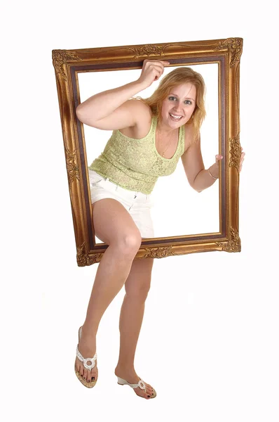 Girl going trough frame. — Stock Photo, Image