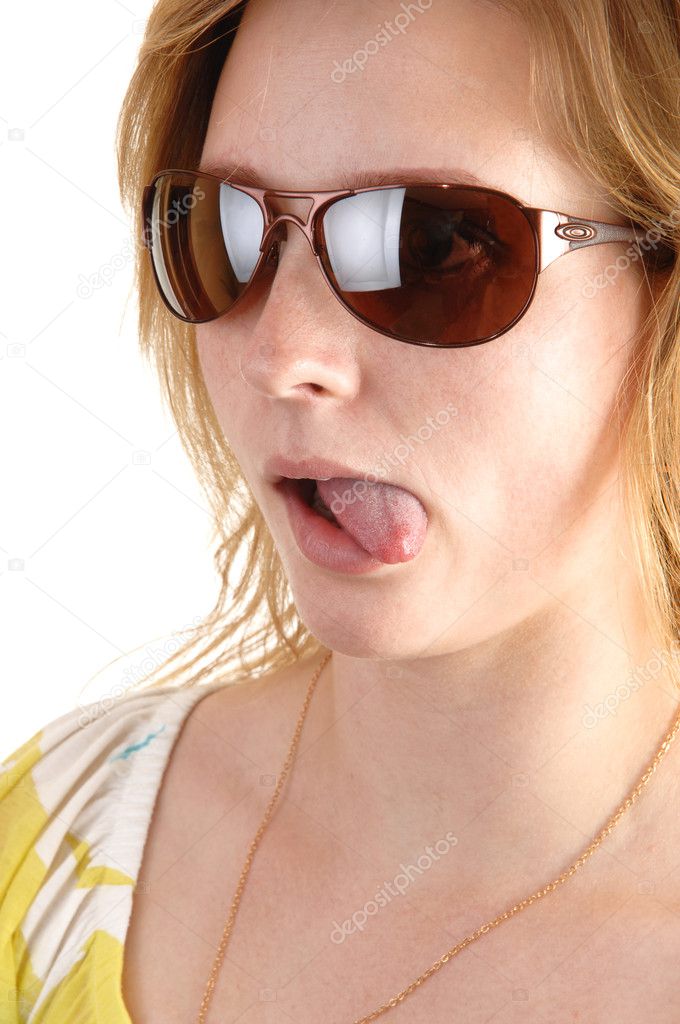 Girl shows tongue.
