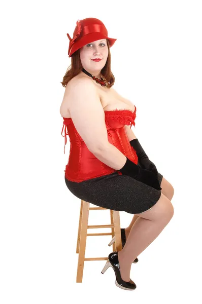 Girl sitting in corset. — Stock Photo, Image
