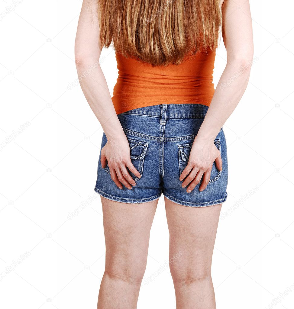 Woman holding her butt.