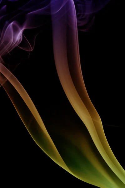 Wave and smoke of different colors on black background — Stock Photo, Image