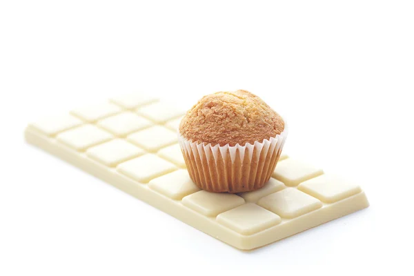 Bar of white chocolate and muffin isolated on white — Stock Photo, Image