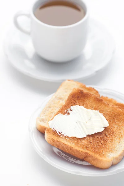 Tea and toast with butter isolated on white — Stock Photo, Image
