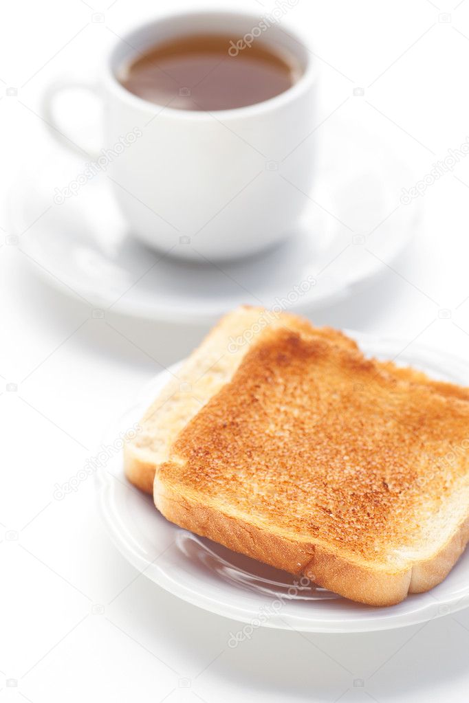 Tea and toast isolated on white