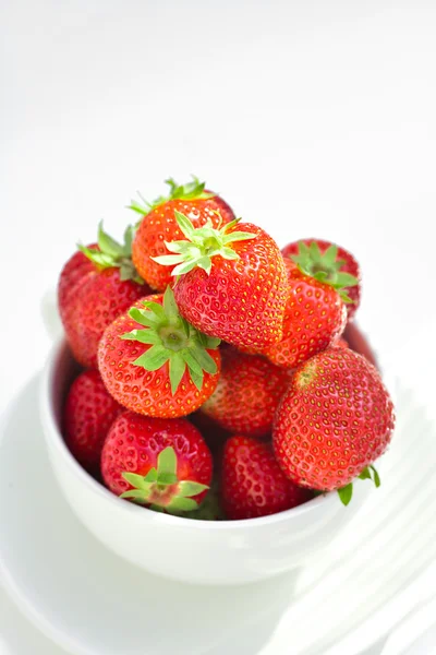 Strawberries in a bowl in the daylight — Stock Photo, Image