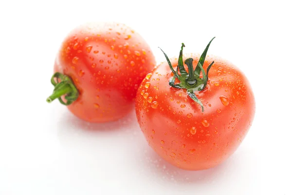 Czerwony dojrzałe pomidory na białym tle — Zdjęcie stockowe