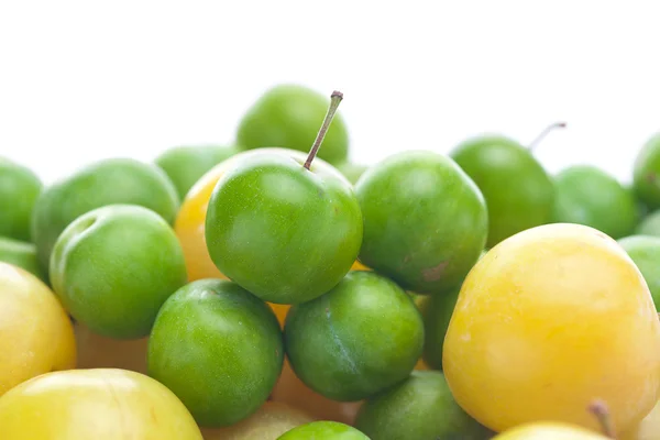 Background of green and yellow plum — Stock Photo, Image