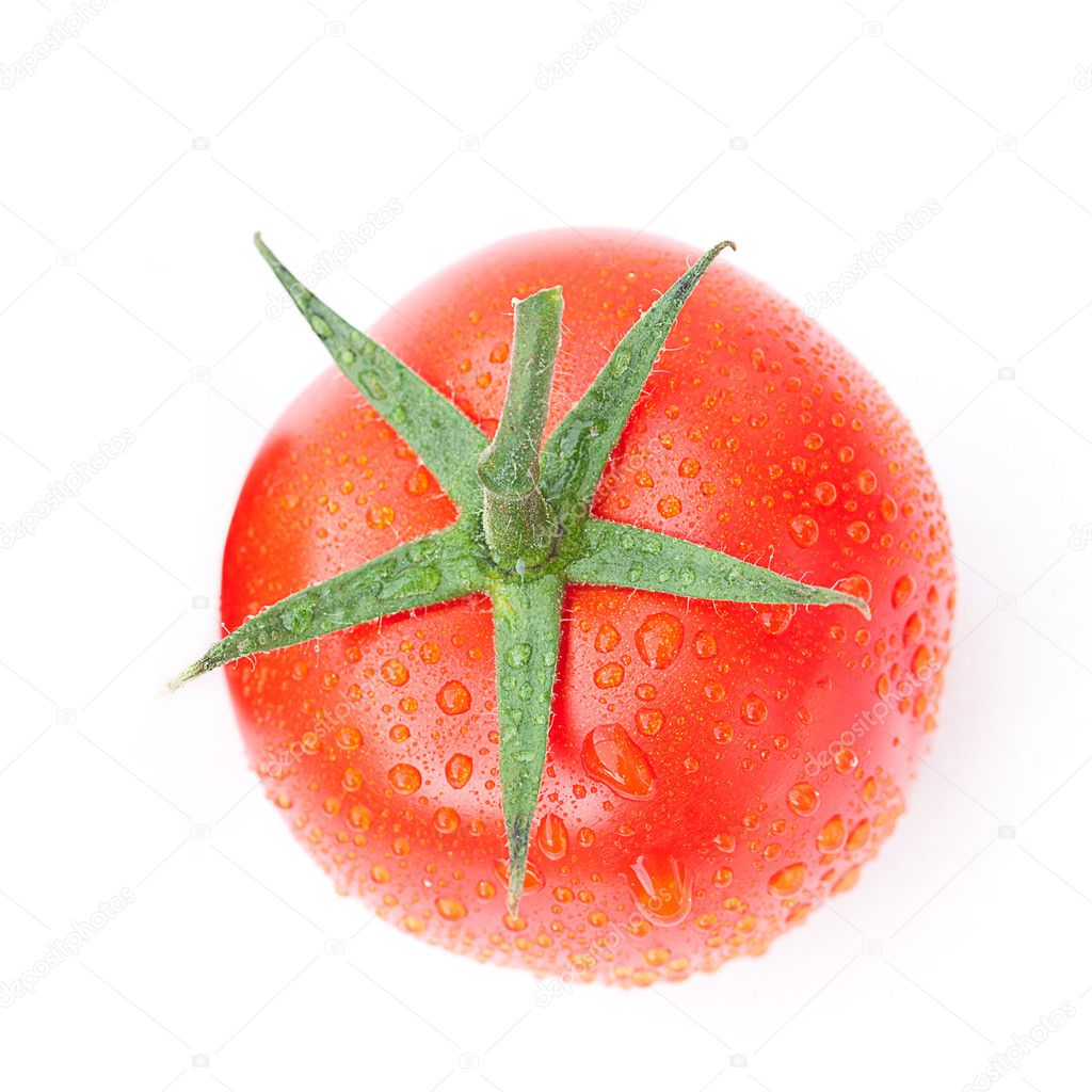 Tomato with water drops isolated on white