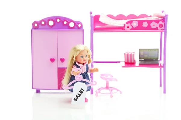 stock image Doll and hanger with a price tag sale,doll wardrobe , bed, chair