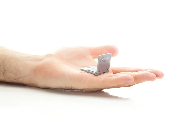 Minyatür laptop üzerinde beyaz izole el — Stok fotoğraf