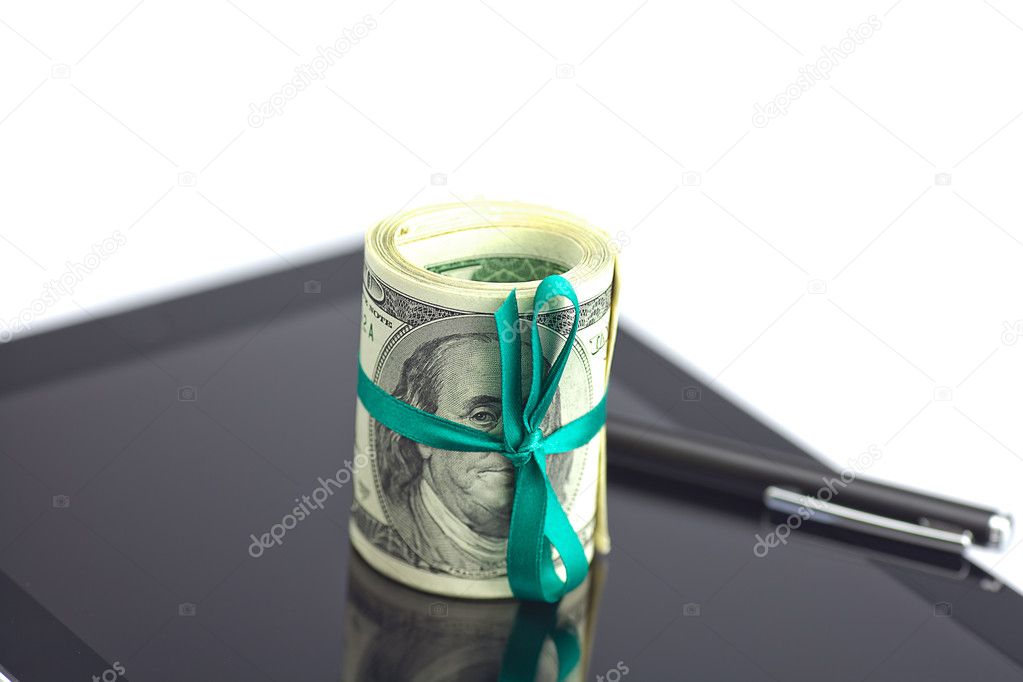 Tablet,tube of dollars and stylus isolated on white