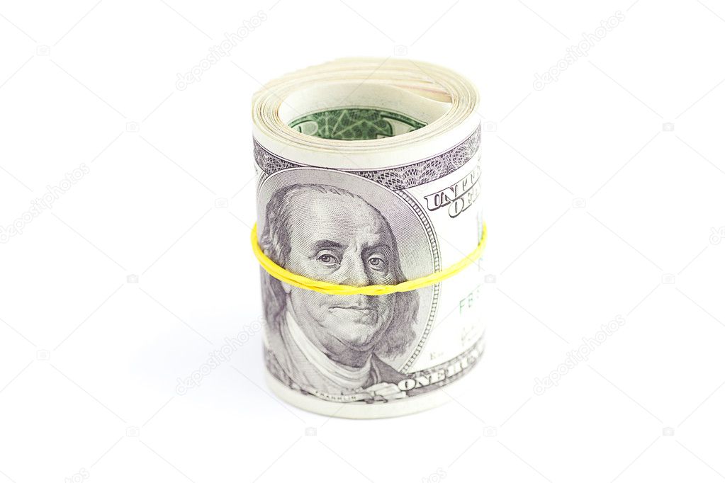 Dollars rolled into a tube tied with an elastic band isolated on