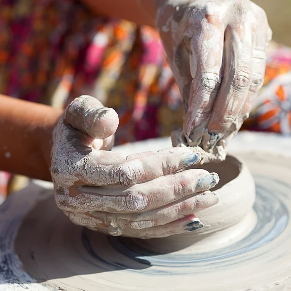 stock image Hand on a potter wheel at the fair